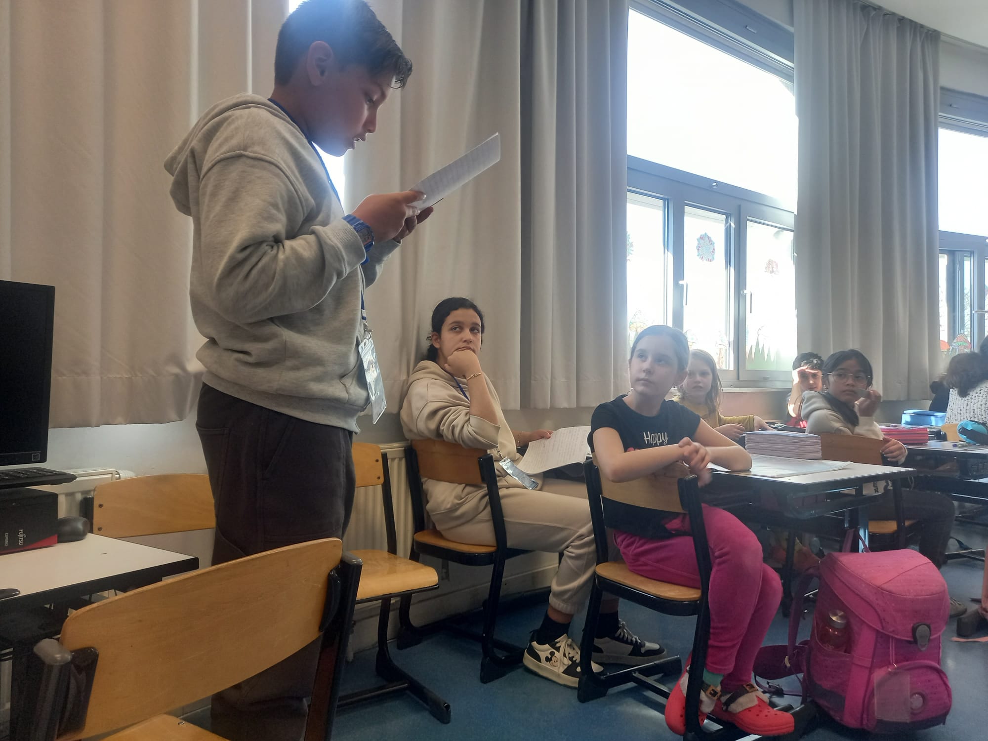 Students proudly displaying their certificates of completion